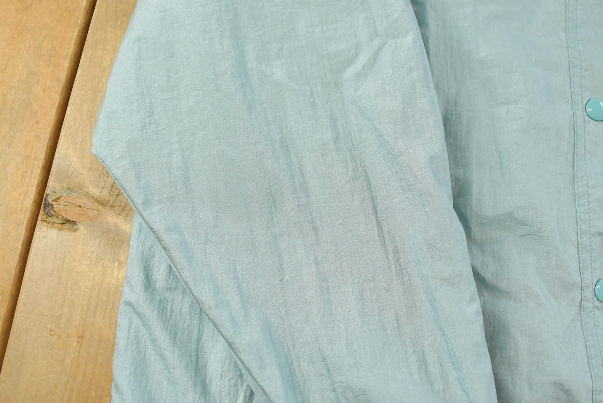 Vintage 1980s Light Blue Nylon Windbreaker Jacket Women's XL from propervintagecanada