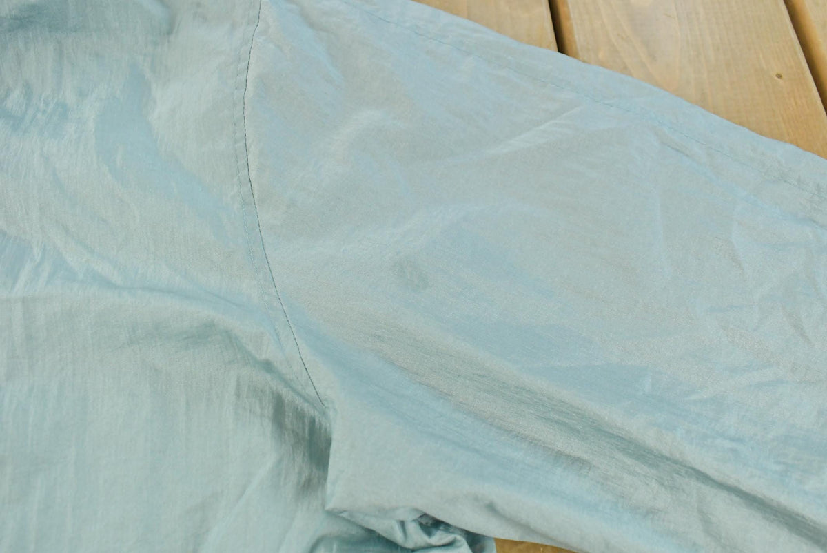 Vintage 1980s Light Blue Nylon Windbreaker Jacket Women's XL from propervintagecanada