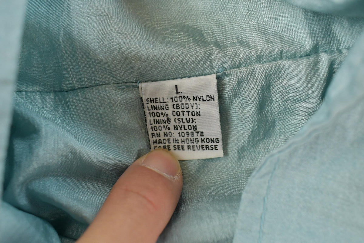 Vintage 1980s Light Blue Nylon Windbreaker Jacket Women's XL from propervintagecanada