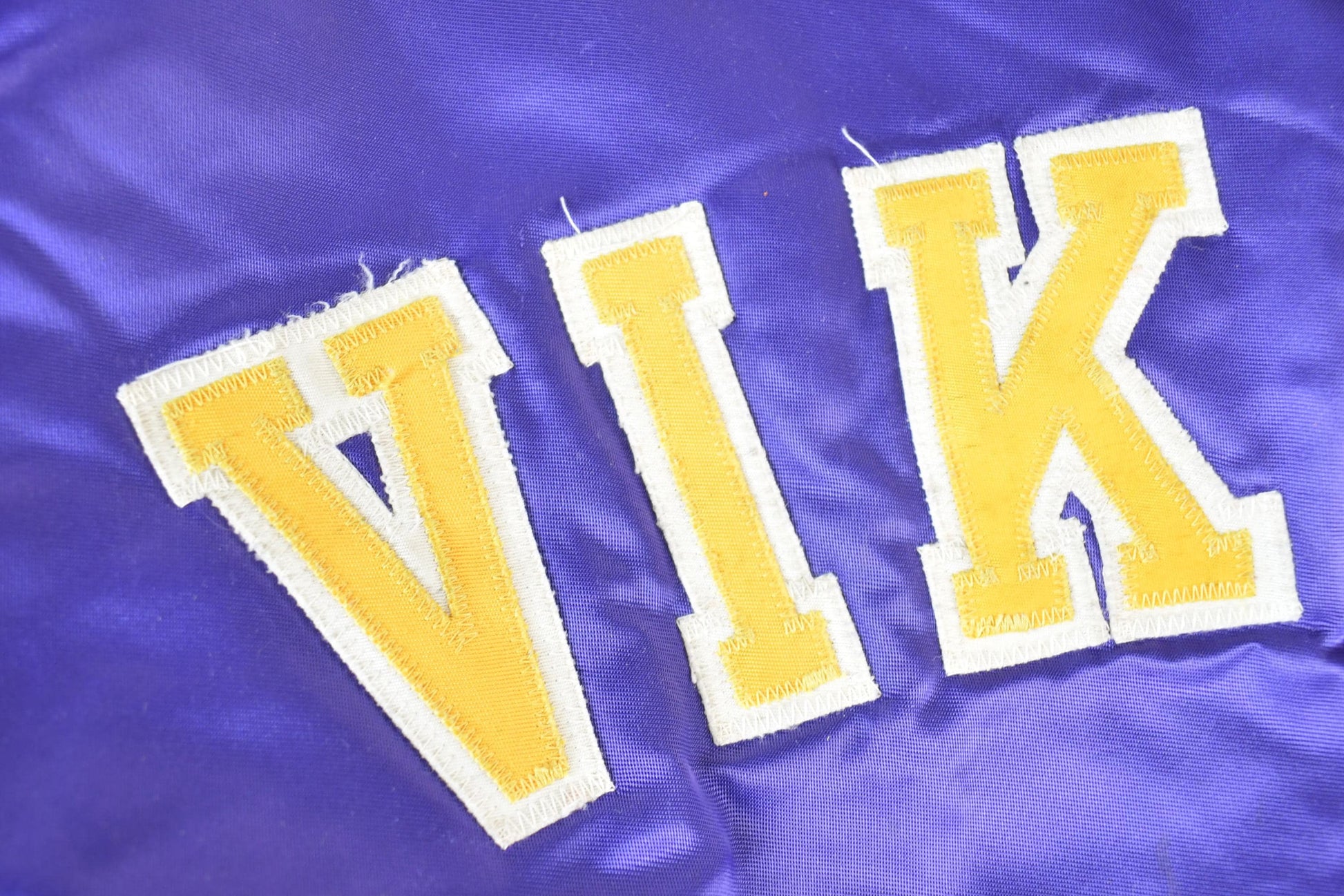 Vintage 1980s Minnesota Vikings Team NFL Football Chalk Line Satin Button Up Bomber Embroidered Puffer Jacket from propervintagecanada