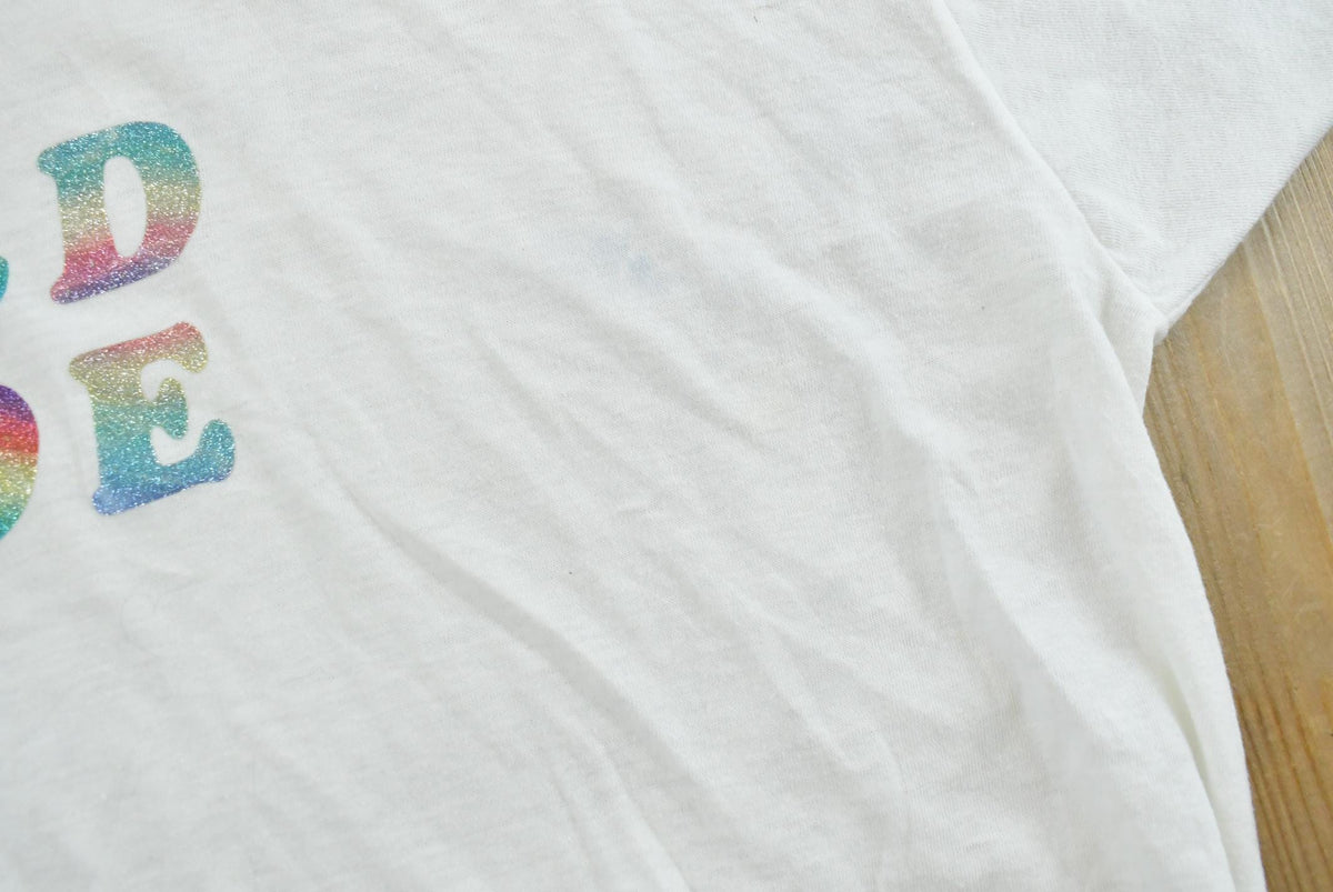 Vintage 1980s Old Doe Rainbow Iron On Print Ringer T-Shirt Men's M from propervintagecanada