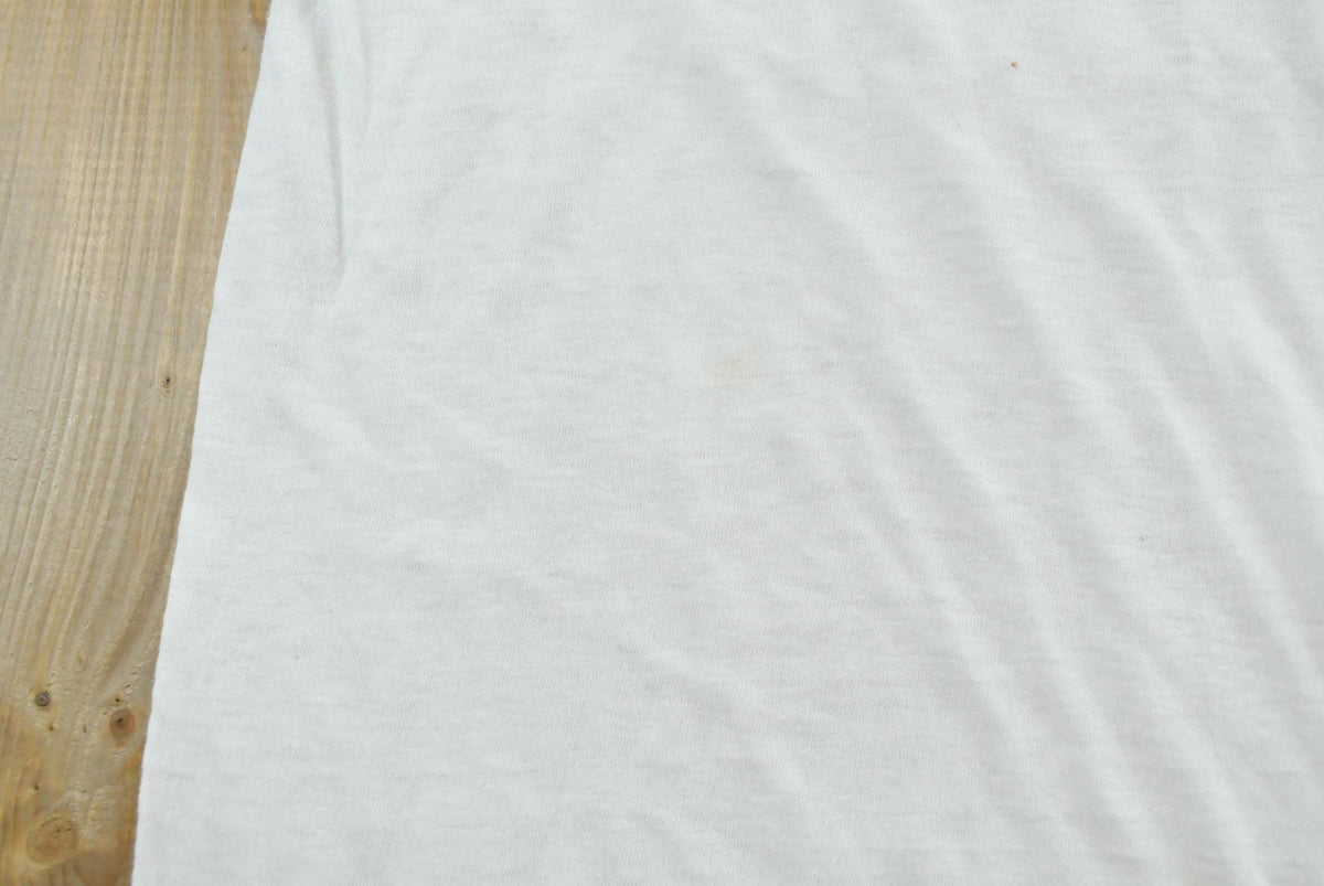 Vintage 1980s Old Doe Rainbow Iron On Print Ringer T-Shirt Men's M from propervintagecanada