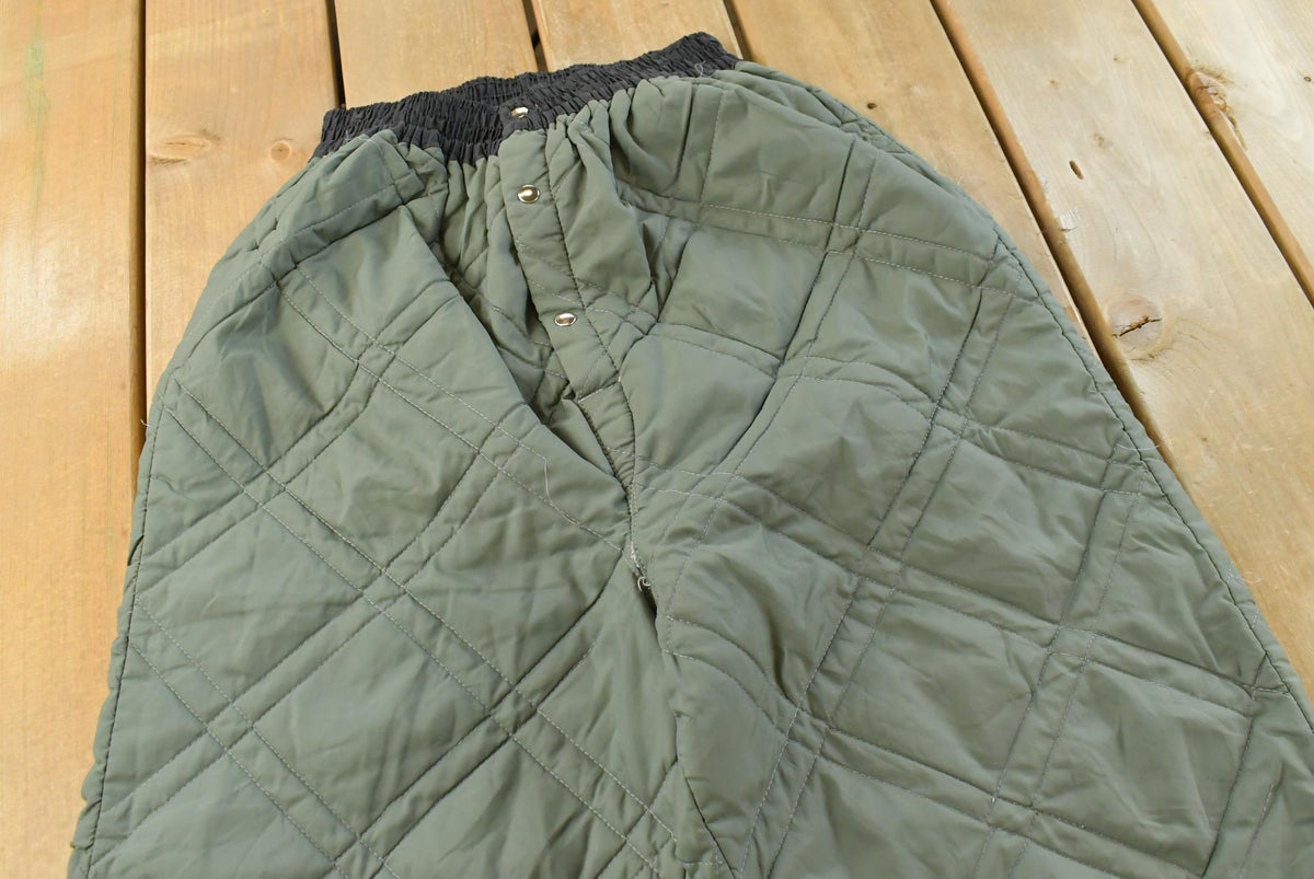 Vintage 1980s Quilted Green Military Liner Puffer Pants Men's XS from propervintagecanada
