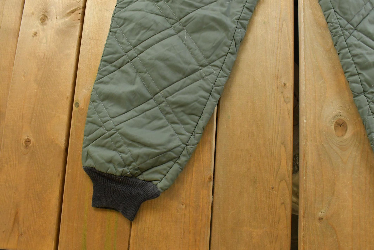Vintage 1980s Quilted Green Military Liner Puffer Pants Men's XS from propervintagecanada