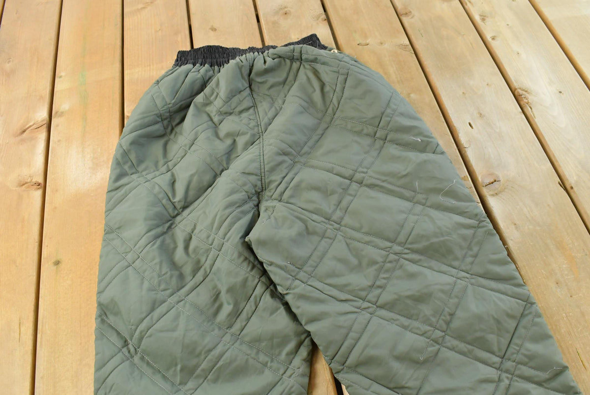 Vintage 1980s Quilted Green Military Liner Puffer Pants Men's XS from propervintagecanada