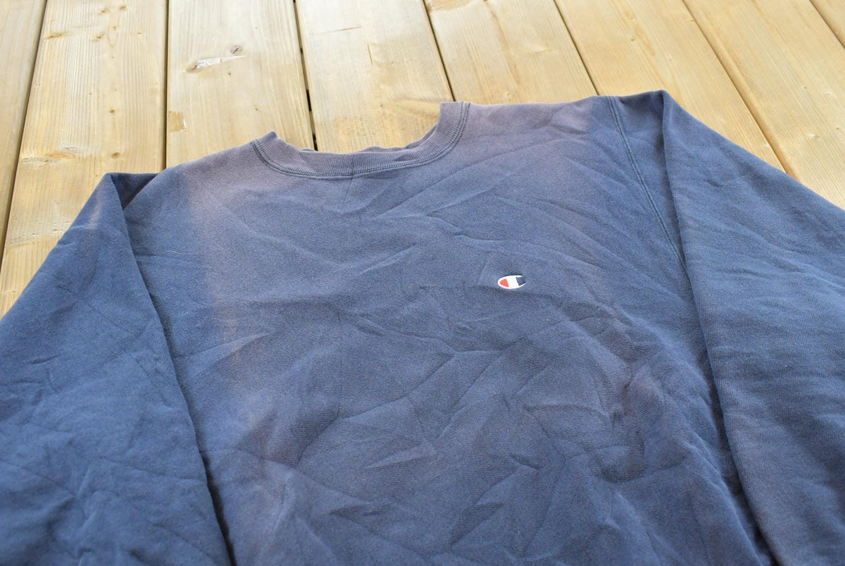 Vintage 1980s Sun Faded Champion Blank Blue Reverse Weave Warm Up Sweatshirt Men's L / Made in USA / 80s Streetwear from propervintagecanada