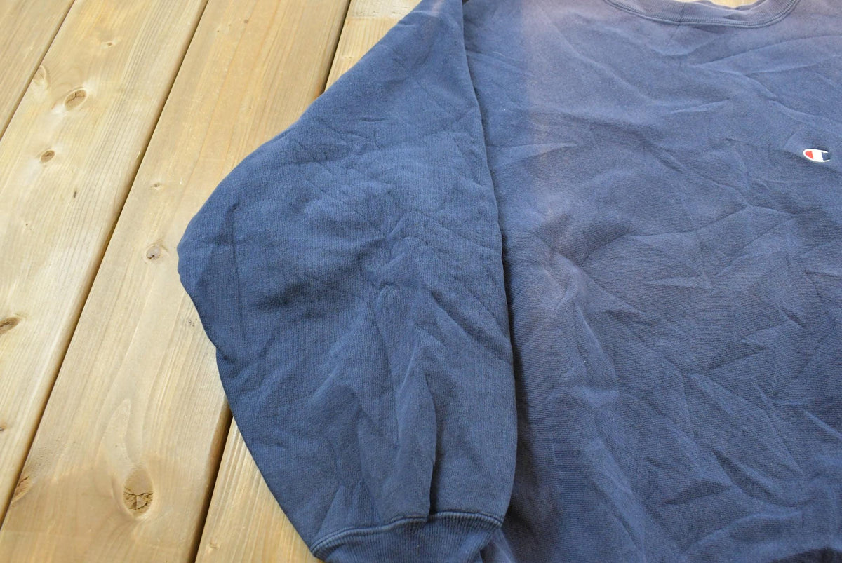 Vintage 1980s Sun Faded Champion Blank Blue Reverse Weave Warm Up Sweatshirt Men's L / Made in USA / 80s Streetwear from propervintagecanada