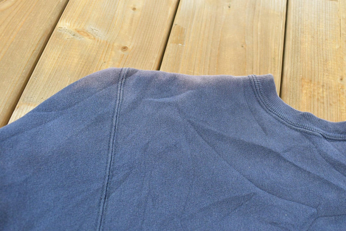 Vintage 1980s Sun Faded Champion Blank Blue Reverse Weave Warm Up Sweatshirt Men's L / Made in USA / 80s Streetwear from propervintagecanada