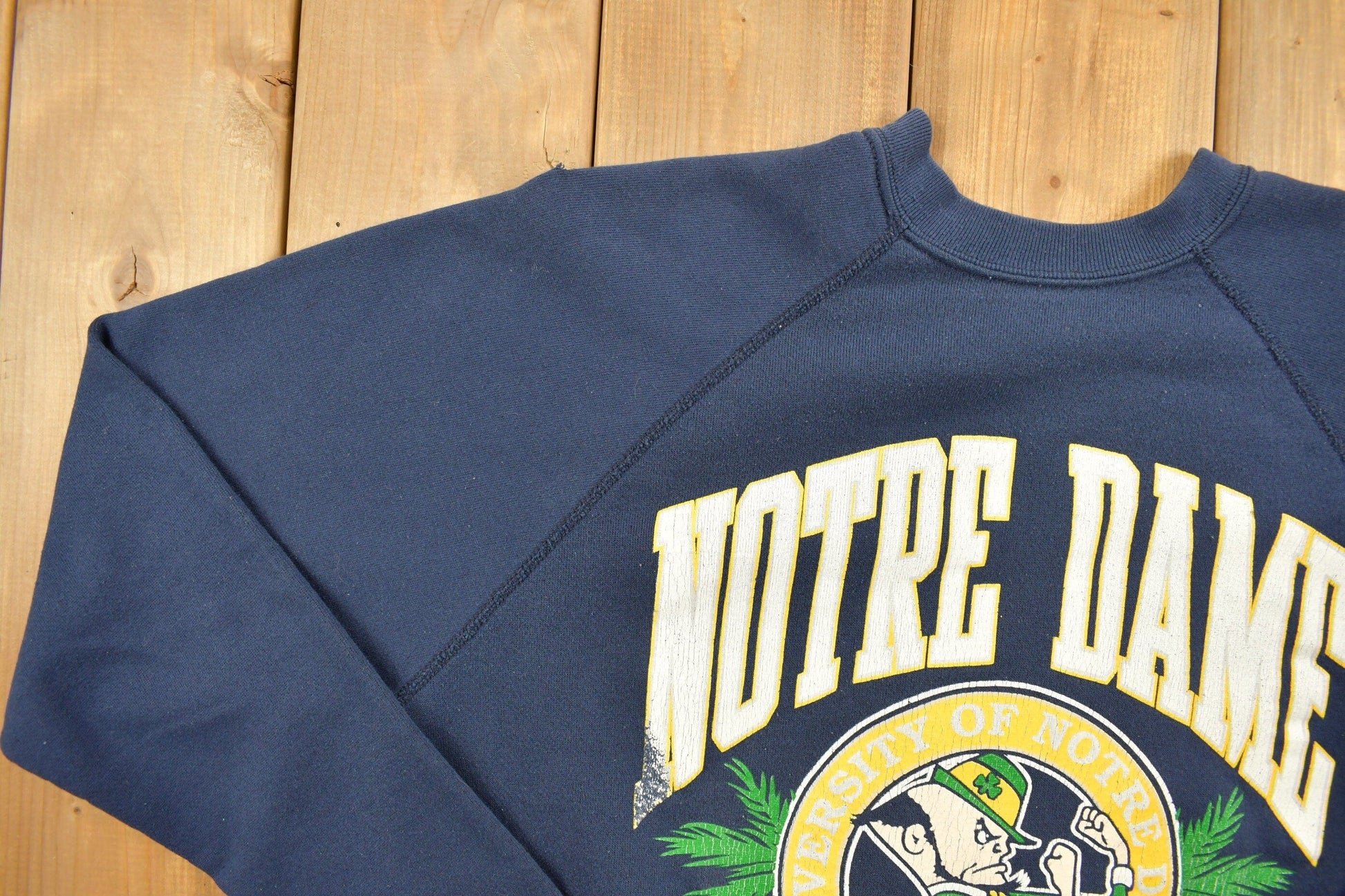Vintage 1980s University Of Notre Dame Fighting Irish Raglan Sweatshirt Men's L from propervintagecanada