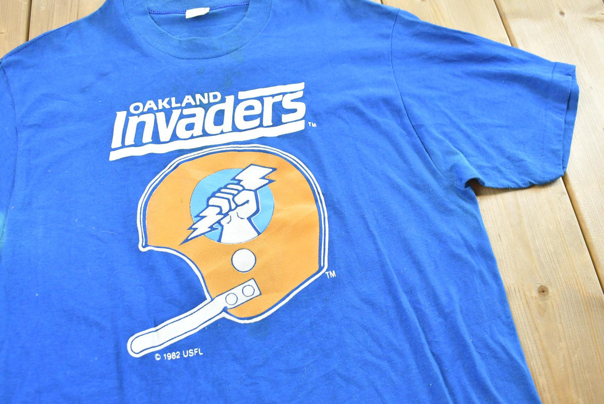 Vintage 1982 Logo 7 USFL Oakland Invaders Football T-Shirt Men M Men's Medium from propervintagecanada