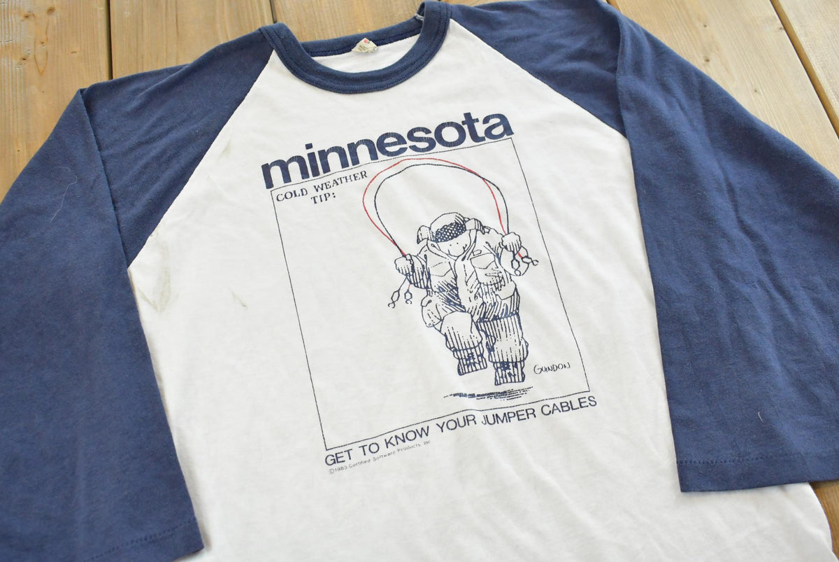 Vintage 1983 Minnesota Cold Weather Jumper Cables Guidon Raglan T-Shirt Mens S from propervintagecanada