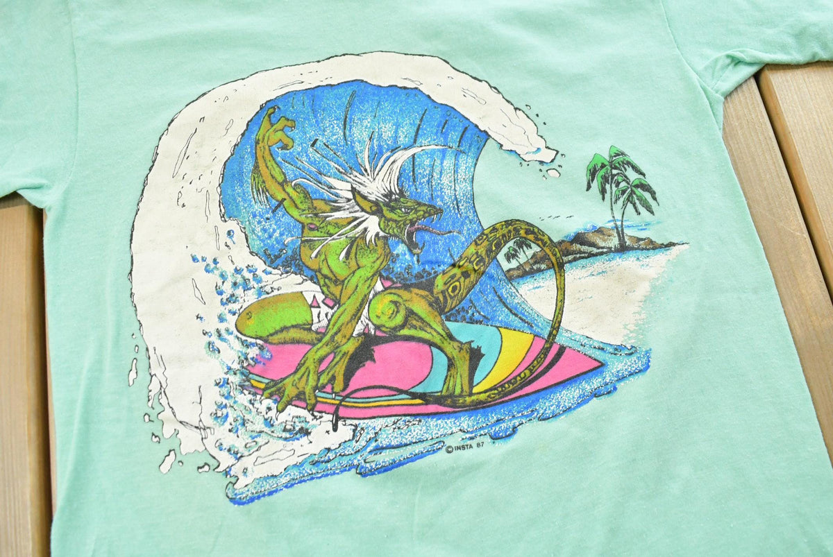 Vintage 1987 Tropical Surfing Monster Souvenir T-Shirt Men's XS from propervintagecanada
