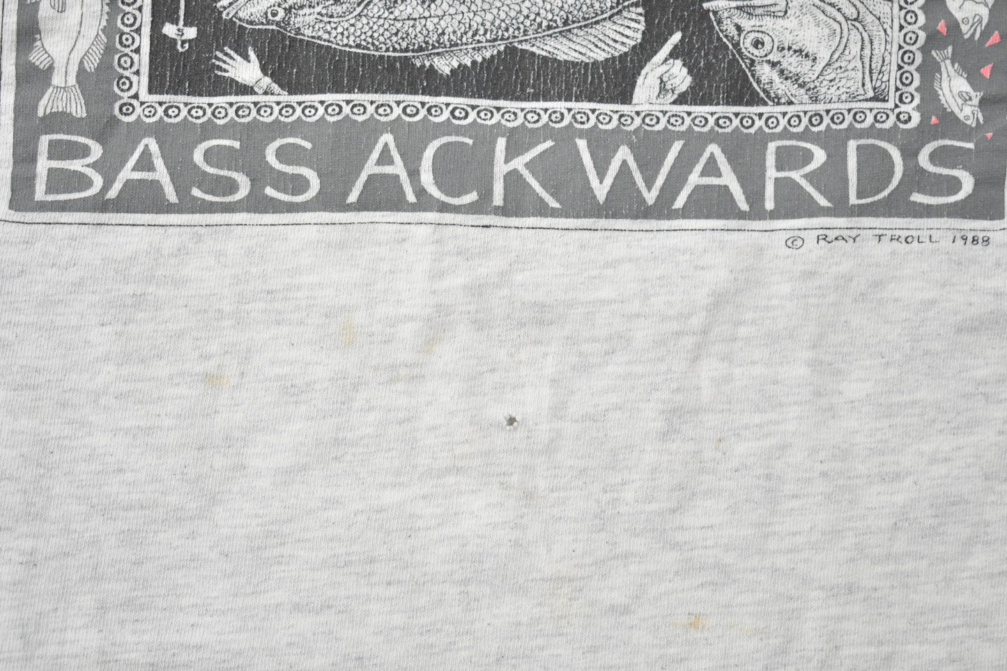 Vintage 1988 Bass Ackwards Fish Ray Troll Graphic T-Shirt Men's Medium from propervintagecanada
