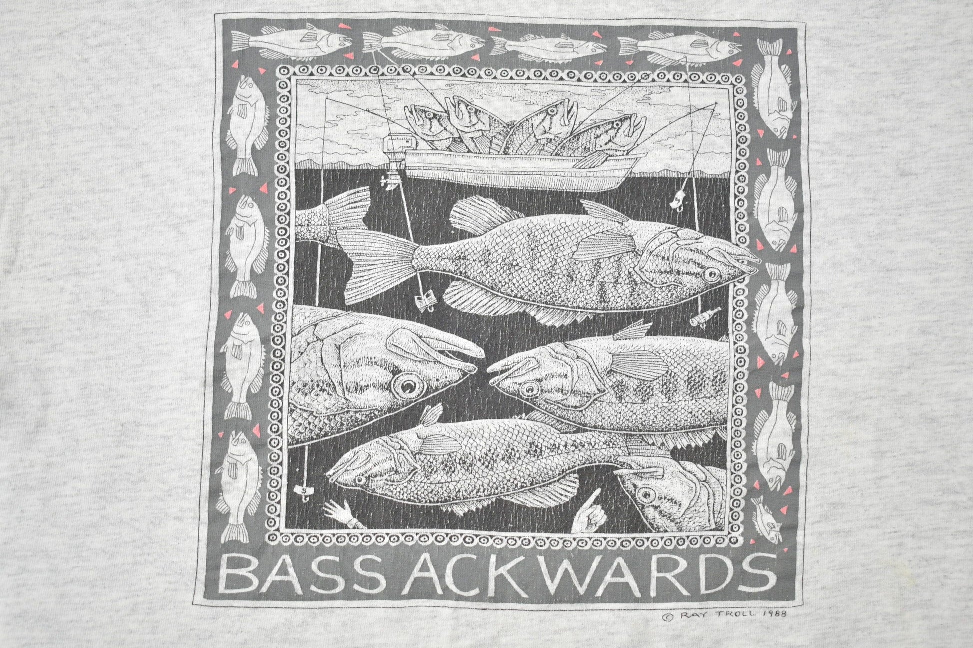 Vintage 1988 Bass Ackwards Fish Ray Troll Graphic T-Shirt Men's Medium from propervintagecanada