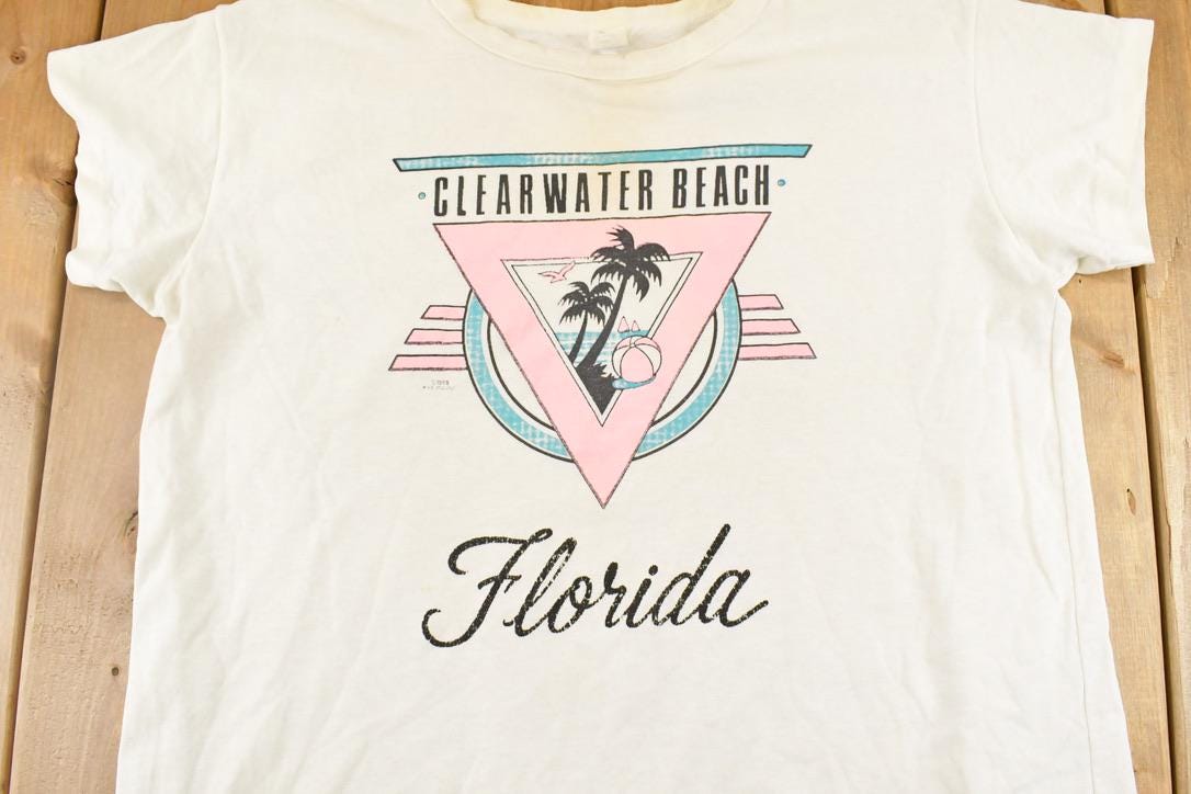 Vintage 1988 Clearwater Beach Florida Thrashed Souvenir Travel T-Shirt Women's XL from propervintagecanada