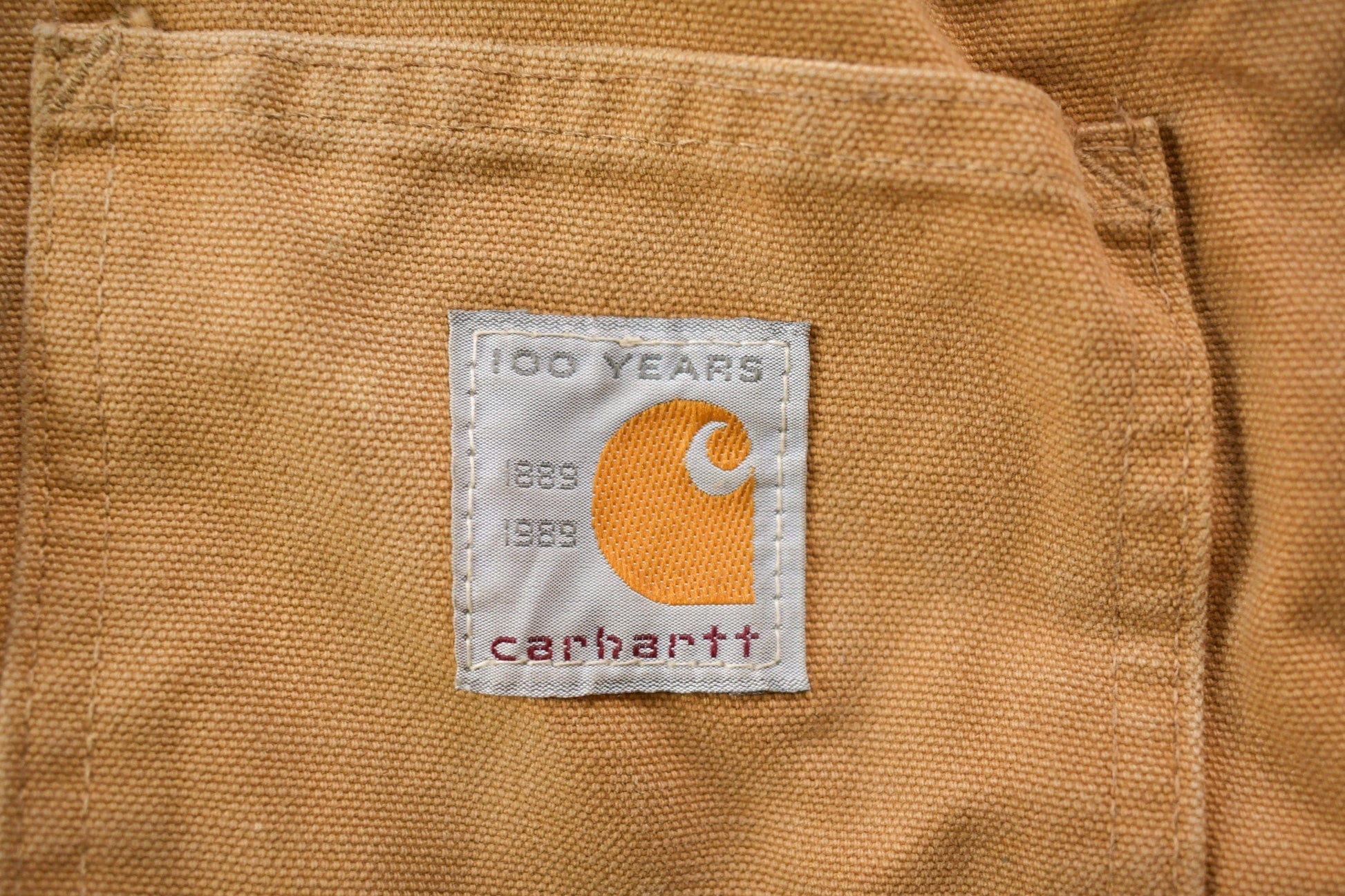 Vintage 1989 Carhartt 100 Years Red Quilt Lined Traditional Coat Hooded Men's 2XL from propervintagecanada