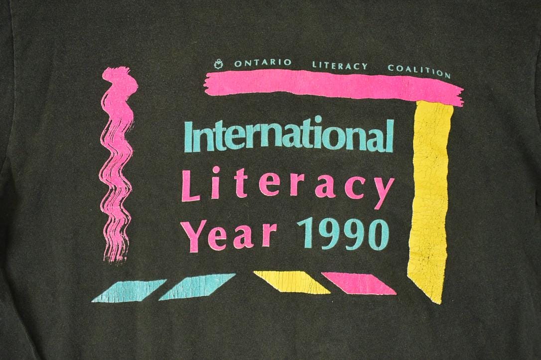 Vintage 1990 International Literacy Year Graphic Print Crewneck Shirt Men's M from propervintagecanada