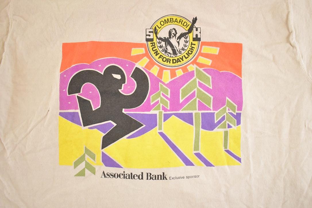 Vintage 1990's Associated Bank Run For Light Souvenir Travel T-Shirt Mens M from propervintagecanada