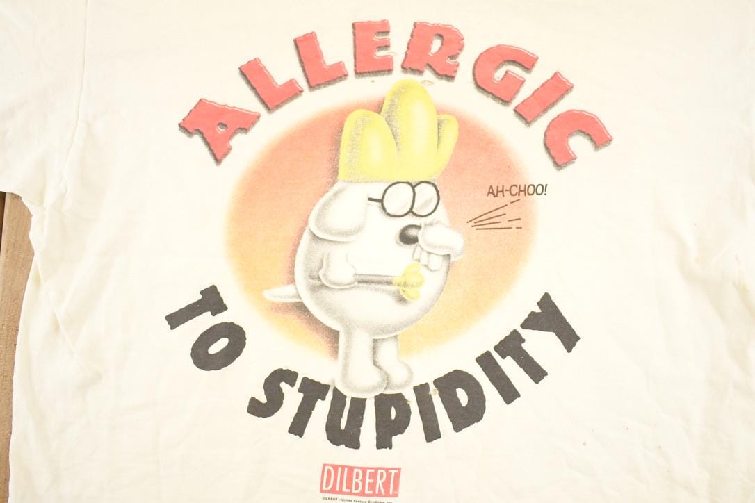 Vintage 1990's Dilbert Allergic To Stupidity Souvenir Funny T-Shirt Men's L from propervintagecanada