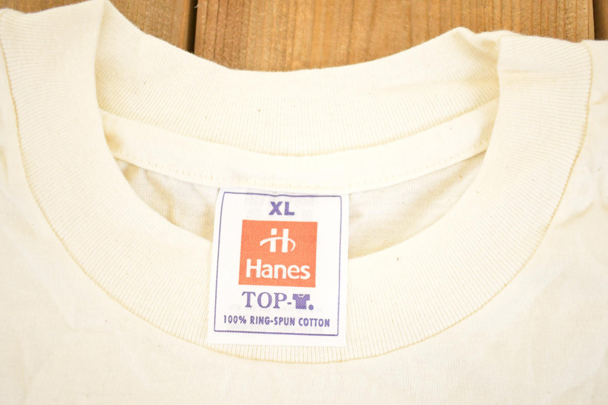 Vintage 1990's Horneck Handicap International Souvenir Travel T-Shirt Men's XL from propervintagecanada