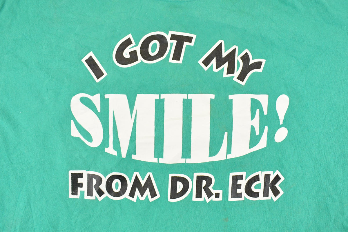 Vintage 1990's I Got My Smile From Dr Eck Souvenir Travel T-Shirt Men's L from propervintagecanada