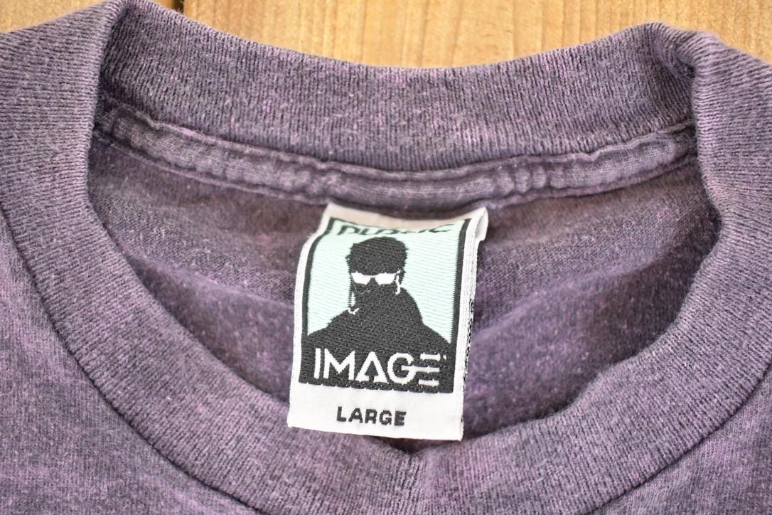 Vintage 1990's Public Image Acid Wash Souvenir Streetwear T-Shirt Men's L from propervintagecanada