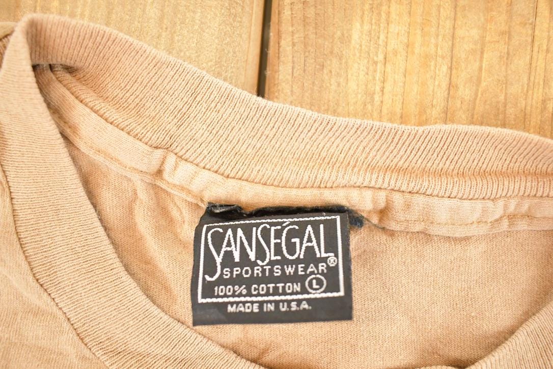 Vintage 1990's San Segal Wolves Souvenir Outdoorsman T-Shirt Men's L from propervintagecanada