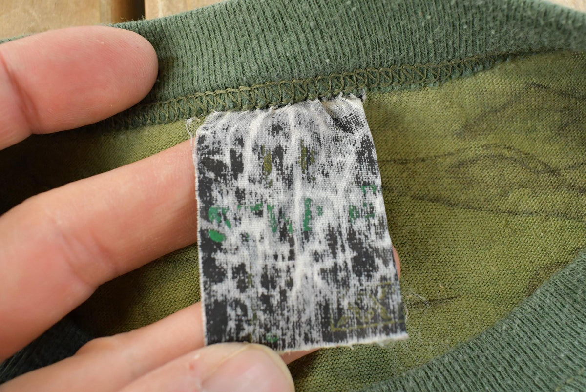Vintage 1990s 1996 Bowhunters Jamboree Camo Graphic T-Shirt Men's L from propervintagecanada