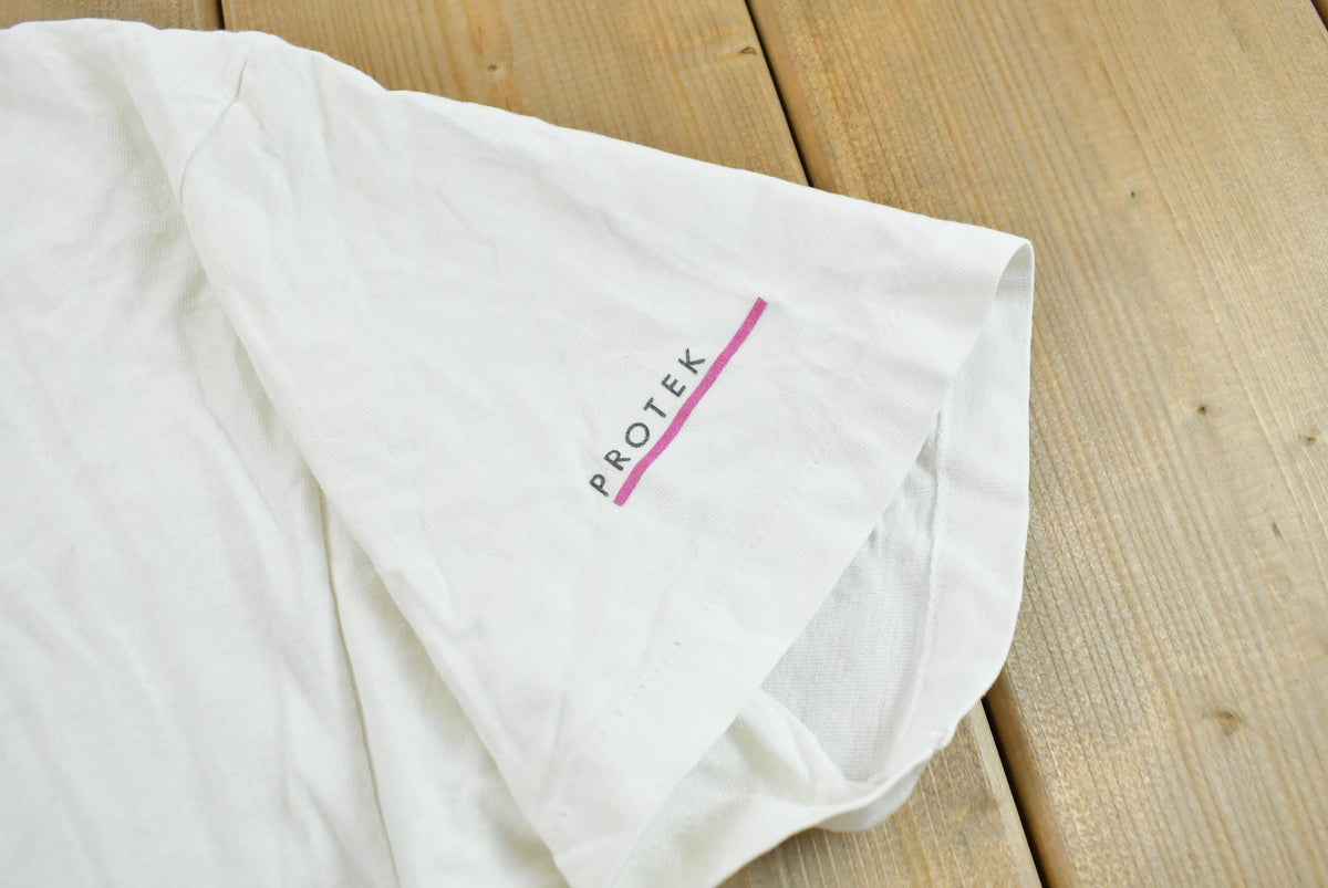 Vintage 1990s Abstract Graphic Protek Promotional T-Shirt Men's L from propervintagecanada