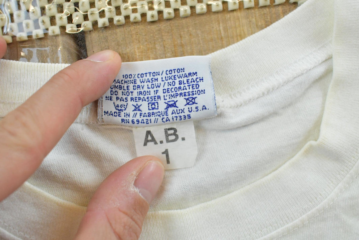 Vintage 1990s Abstract Reebok Promotional T-Shirt Men's Cropped XL from propervintagecanada