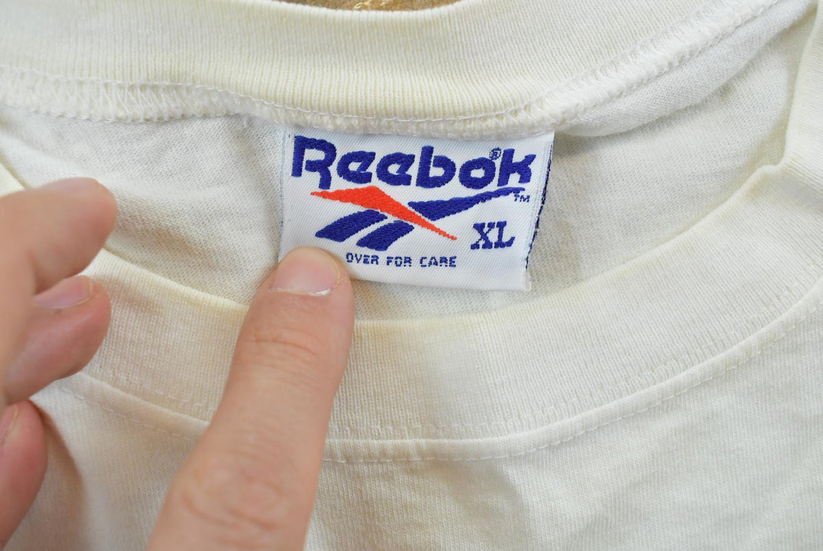 Vintage 1990s Abstract Reebok Promotional T-Shirt Men's Cropped XL from propervintagecanada