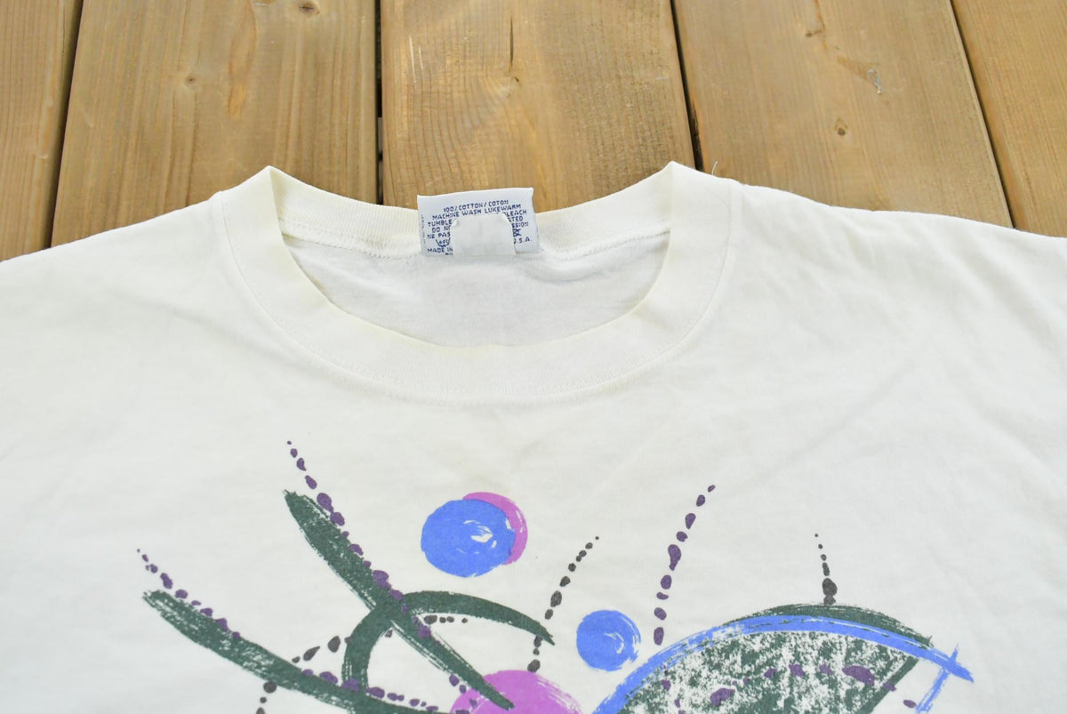 Vintage 1990s Abstract Reebok Promotional T-Shirt Men's Cropped XL from propervintagecanada