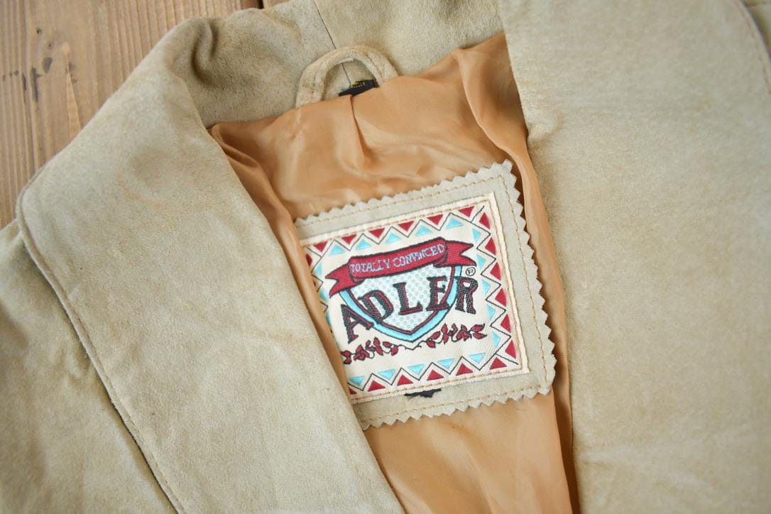 Vintage 1990s Adler Beige Suede LeatherFringe Jacket Women's M-L from propervintagecanada