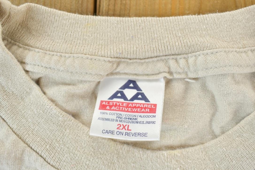 Vintage 1990s Albuquerque NM Cowboy Dogs Graphic T-Shirt Men's XL from propervintagecanada