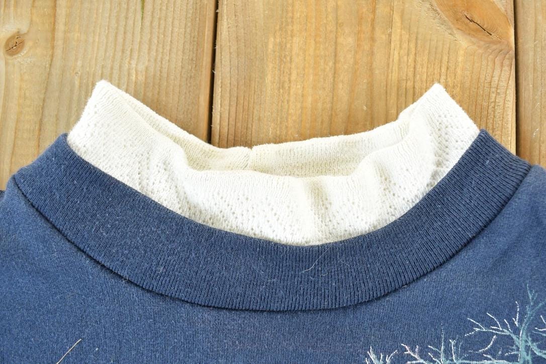 Vintage 1990s All Over Print Winter Theme Laceneck Crewneck Sweatshirt Men's Large from propervintagecanada