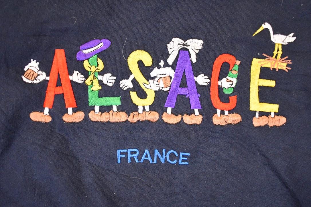 Vintage 1990s Alsace France Embroidered Cartoon Crewneck Sweatshirt Mens XL / Made In USA / 90's Destination Sweater from propervintagecanada