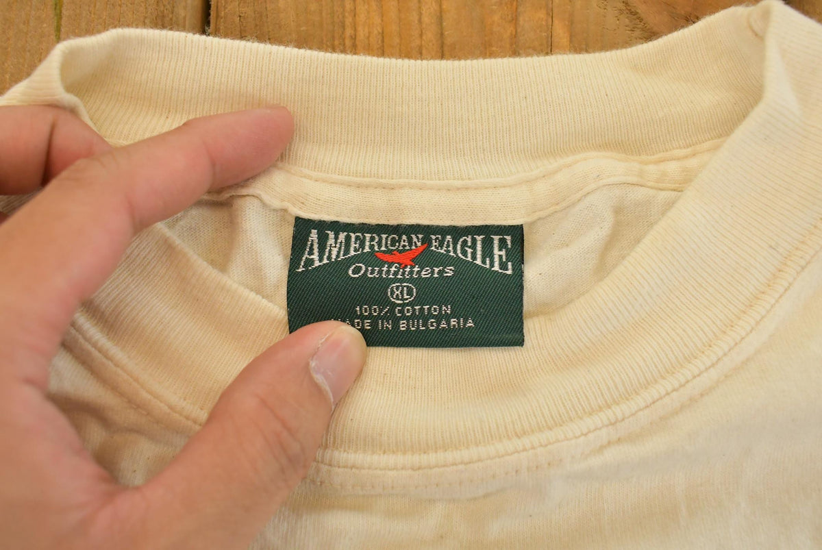 Vintage 1990s American Eagle Outfitters Wizard Mountain Graphic T Shirt Men's XL from propervintagecanada