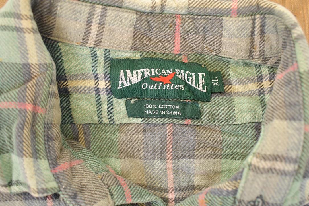 Vintage 1990s American Eagle Plaid Button Up Shirt Men's XL from propervintagecanada