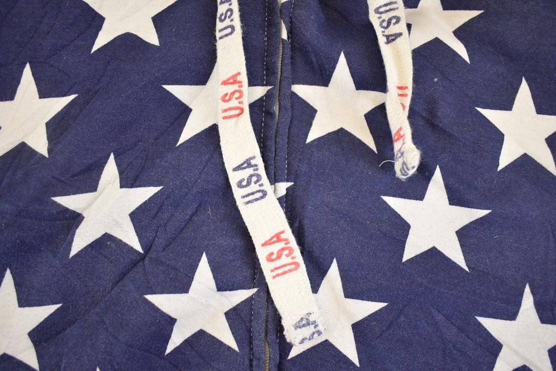 Vintage 1990s American Flag AOP Isaacs Designs Souvenir Hoodie Sweatshirt Men's XXL from propervintagecanada