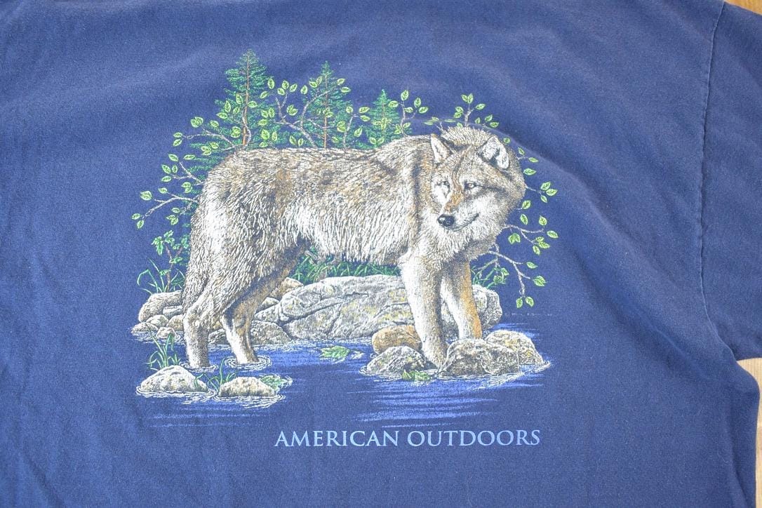 Vintage 1990s American Outdoors Wolf Souvenir Single Stitch Graphic Print T-Shirt Made In Men's XL from propervintagecanada