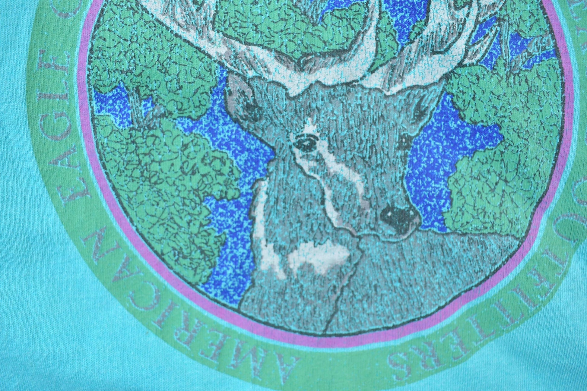 Vintage 1990s American Outfitters Deer Theme Graphic T-Shirt Men's L from propervintagecanada