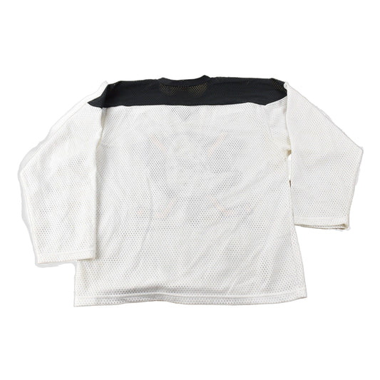 Vintage 1990s Anaheim Mighty Ducks NHL Ravens Hockey Jersey Made In Canada Size Youth Large from propervintagecanada