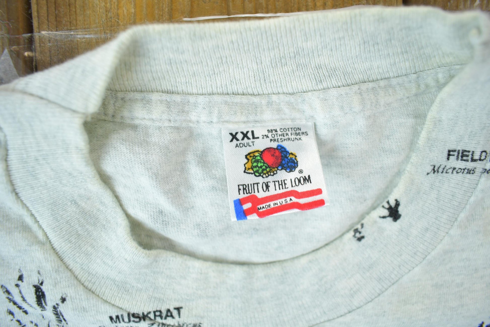 Vintage 1990s Animal Tracks All Over Print Graphic T-Shirt Men's 2XL from propervintagecanada