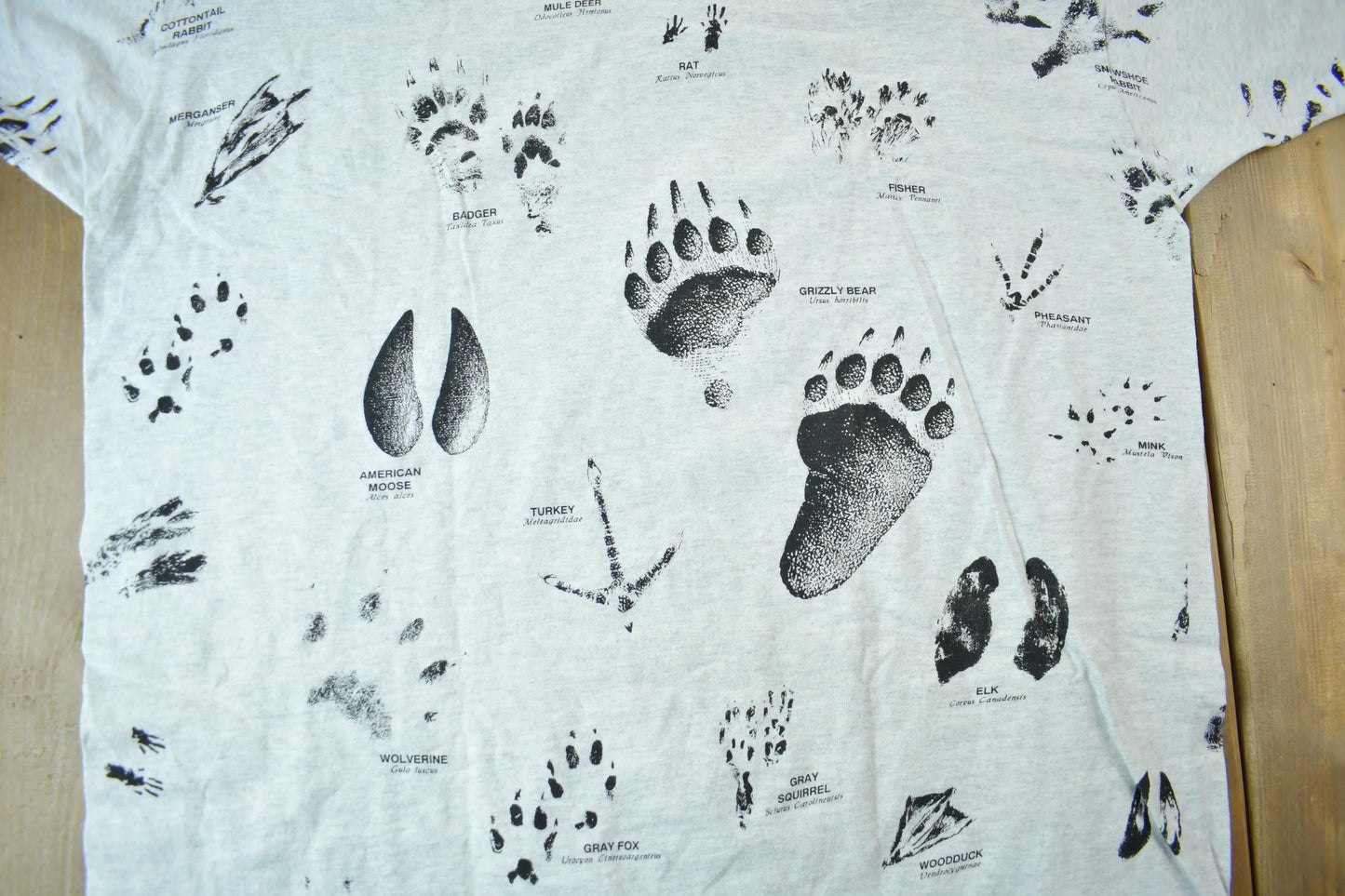 Vintage 1990s Animal Tracks All Over Print Graphic T-Shirt Men's 2XL from propervintagecanada