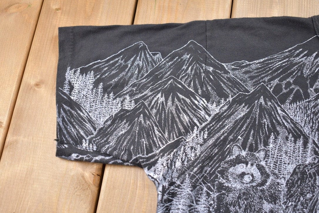 Vintage 1990s Animals All Over Print Graphic T-Shirt Men's Large from propervintagecanada