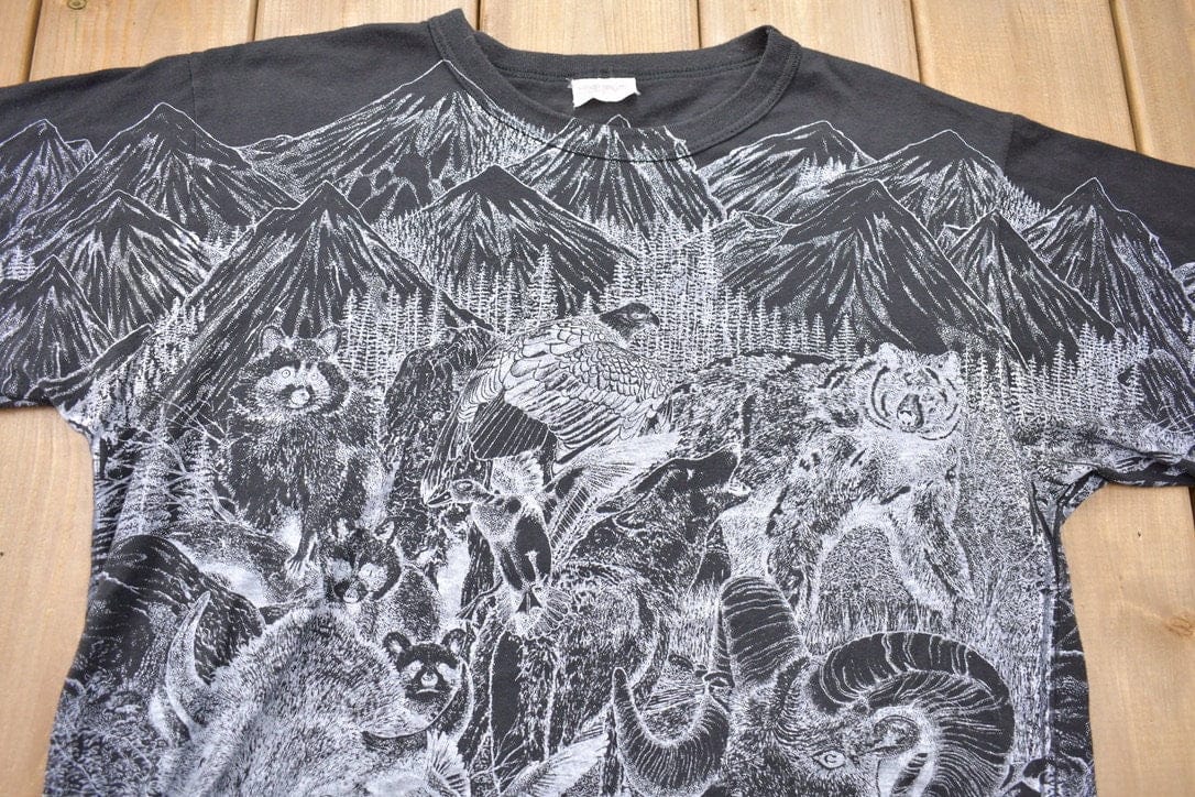 Vintage 1990s Animals All Over Print Graphic T-Shirt Men's Large from propervintagecanada