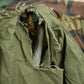 Vintage 1990s Army Woodland Camo Military Field Jacket Men's Large from propervintagecanada