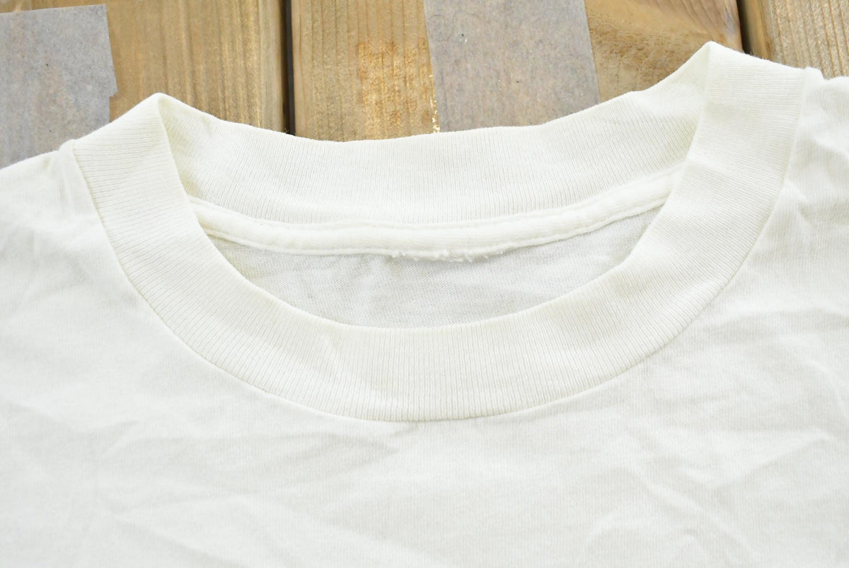 Vintage 1990s Atlantic Beach North Carolina Sea Shell Souvenir Travel T Shirt Made In USA Mens XL from propervintagecanada