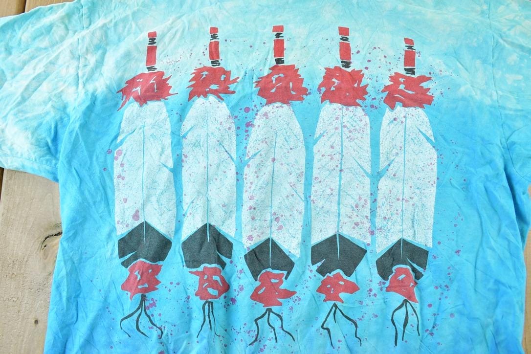 Vintage 1990s Aztec Souvenir Feather Single Stitch Graphic Print T-Shirt Men's Large from propervintagecanada