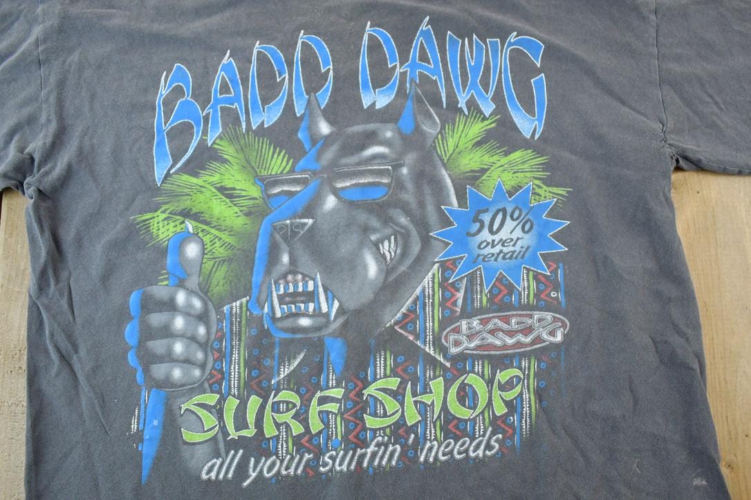 Vintage 1990s Bad Dog Surf Show Souvenir Single Stitch Graphic Print T-Shirt Men's XL from propervintagecanada